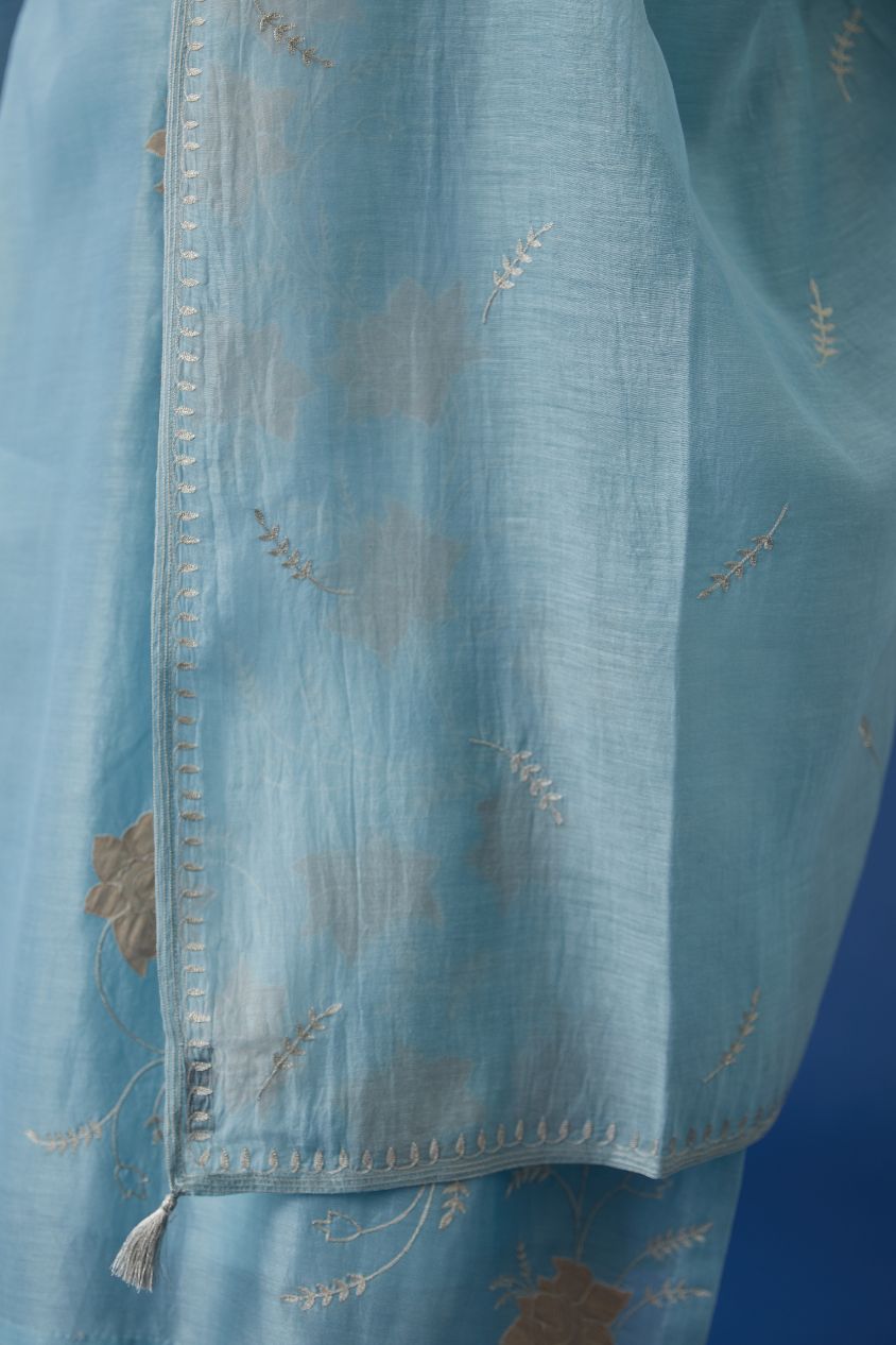 Silk chanderi straight kurta set with all-over tissue chanderi applique work highlighted with silver zari embroidery.