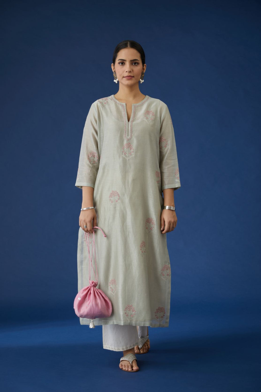 Sea green silk chanderi kurta set, detailed with all-over contrast silk thread and zari embroidery.