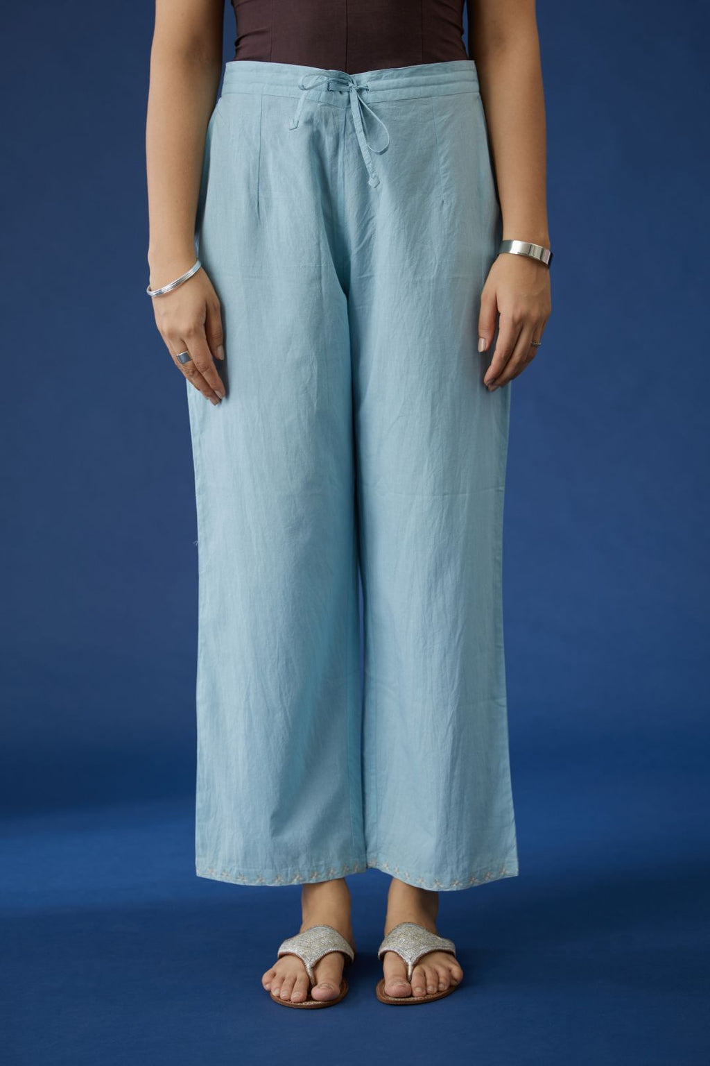 Baby blue cotton straight pants with silver zari embroidery at bottom hem (Pants)