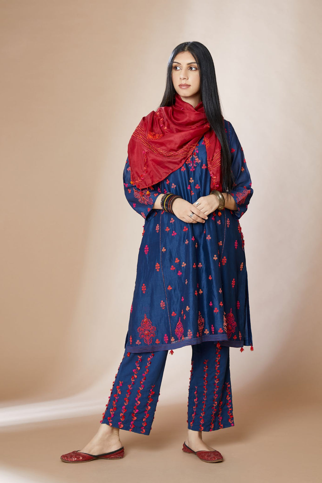 Indigo blue short kalidar kurta set, highlighted with delicate contrast coloured embroidery