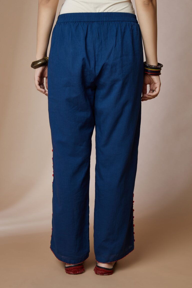 Indigo blue cotton straight pants with bird and tassel embroidery at sides