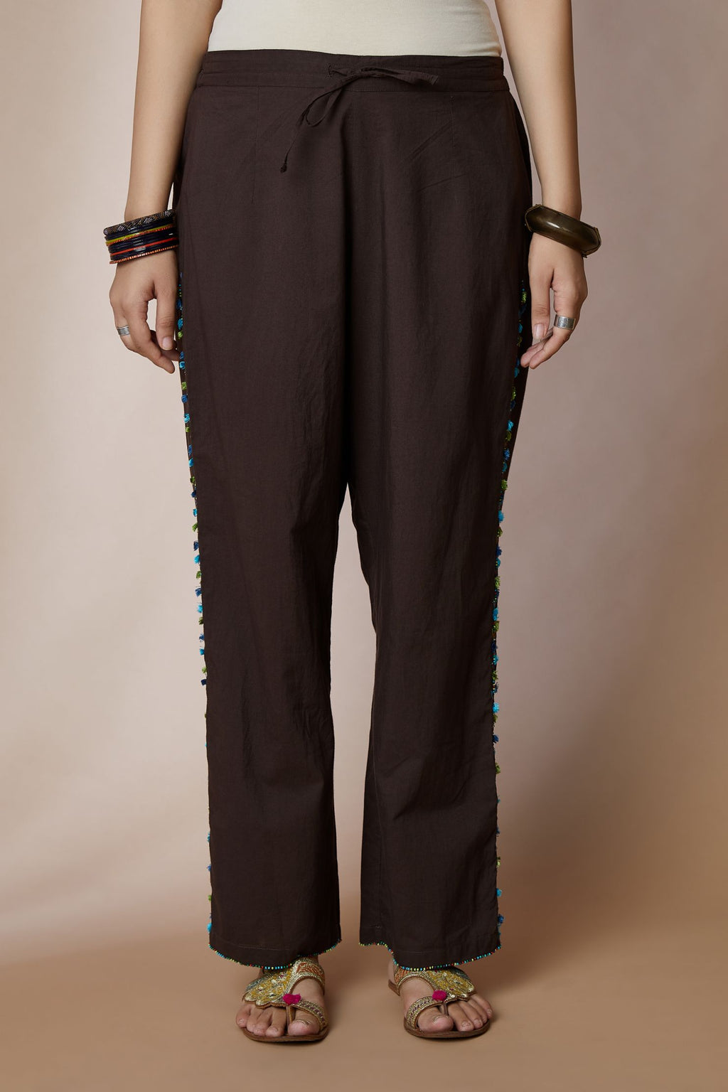 Cocoa brown cotton straight pants with bird and tassel embroidery at sides