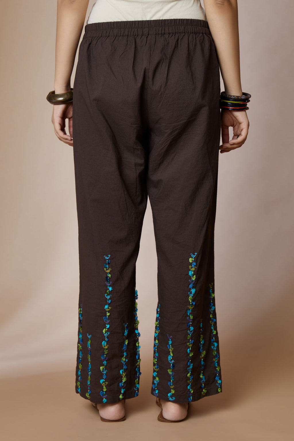 Cocoa brown cotton straight pants with bird and tassel stripes at hem