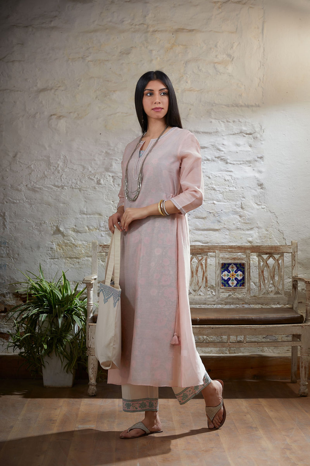 Pink embroidered straight kurta with tying cord at waist sides and printed slip paired with cotton hand block printed straight pant