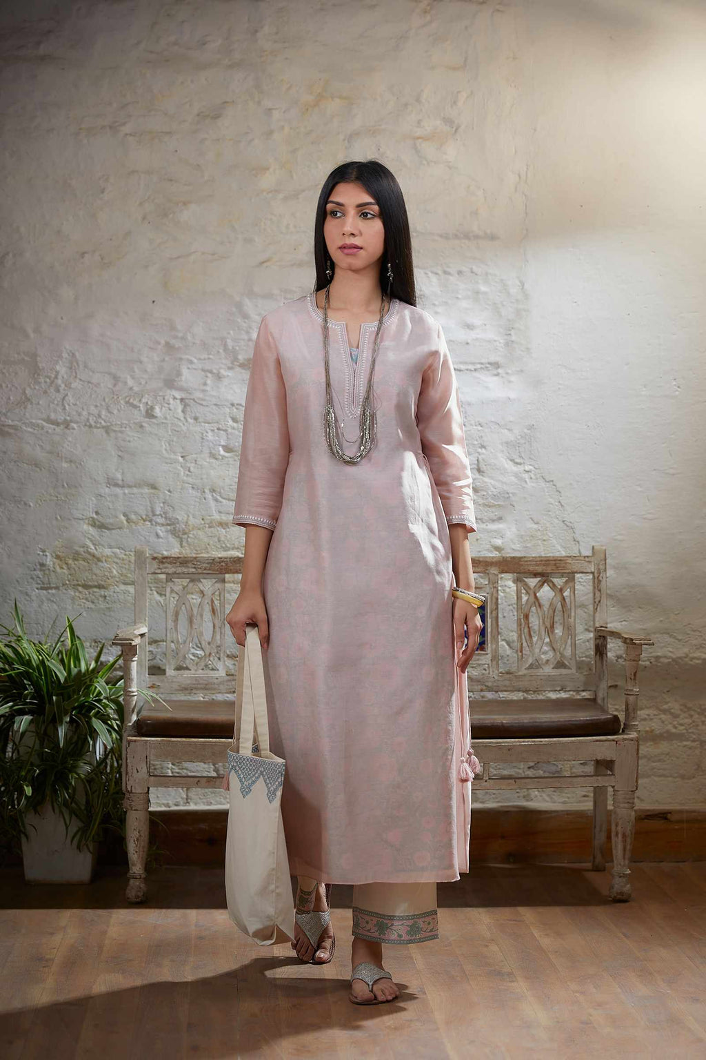 Pink embroidered straight kurta with tying cord at waist sides and printed slip paired with cotton hand block printed straight pant