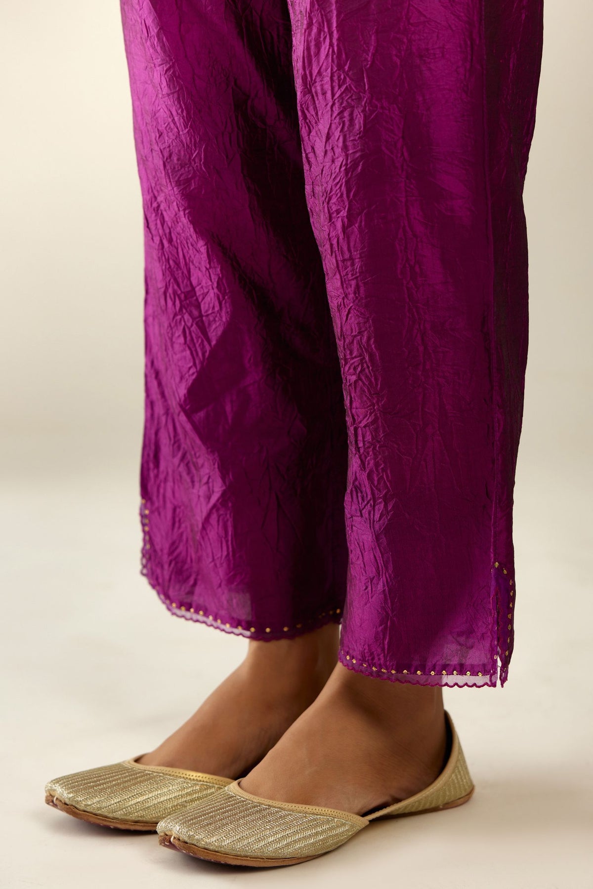 Sangria hand crushed silk straight pants with scalloped and embroidered organza at edges and detailed with a single line of sequins at hem