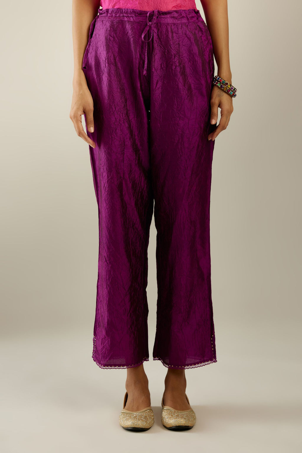 Sangria hand crushed silk straight pants with scalloped and embroidered organza at edges and detailed with a single line of sequins at hem