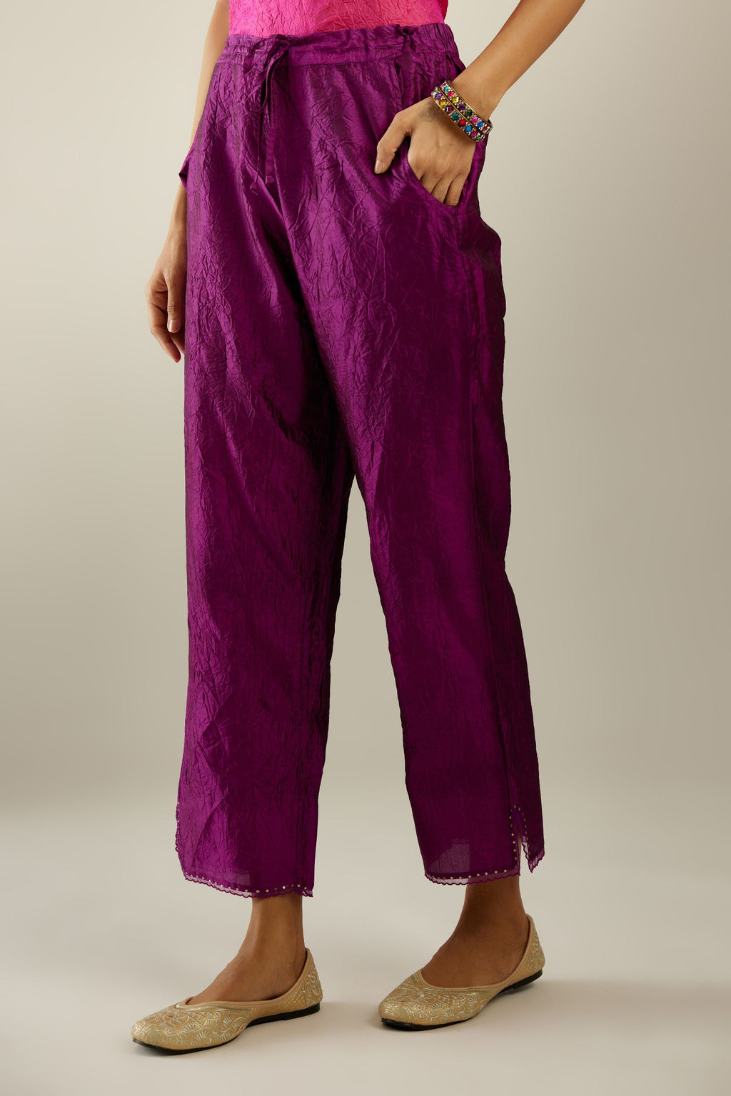 Sangria hand crushed silk straight pants with scalloped and embroidered organza at edges and detailed with a single line of sequins at hem