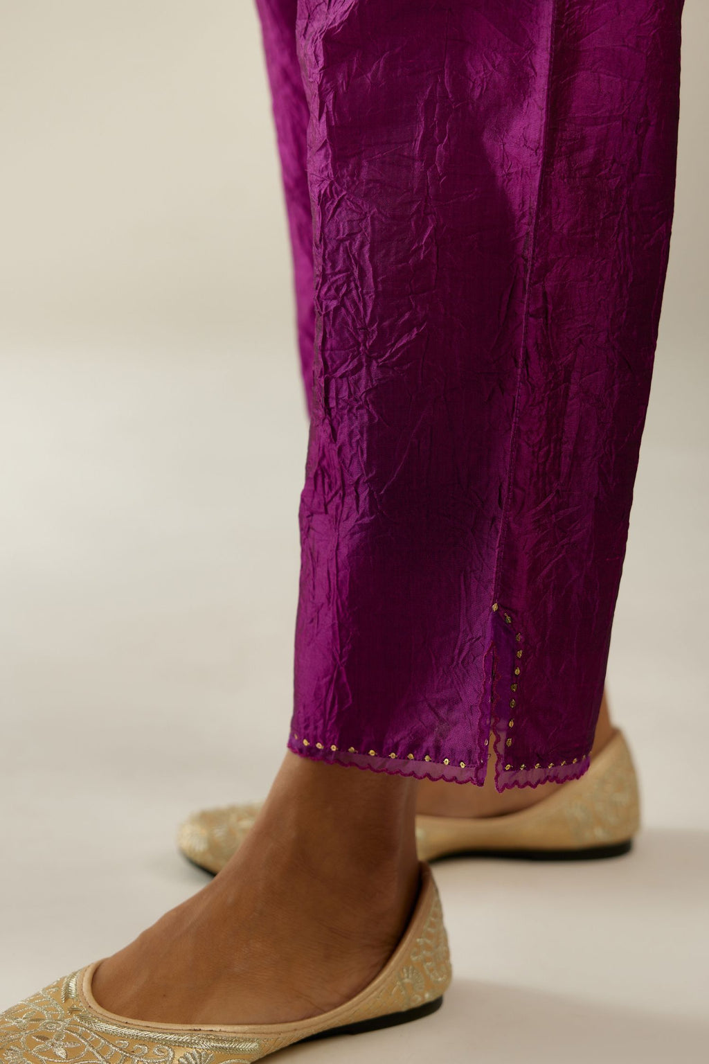 Sangria hand crushed silk straight pants with scalloped and embroidered organza at edges and detailed with a single line of sequins at hem