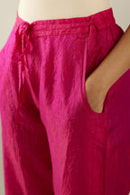 Jazzberry jam hand crushed silk straight pants with scalloped and embroidered organza at edges and detailed with a single line of sequins at hem
