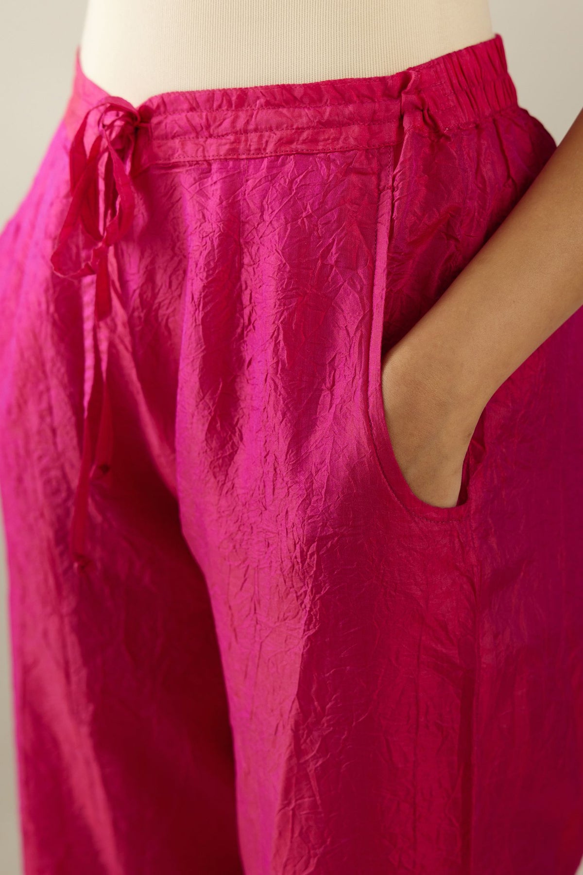 Jazzberry jam hand crushed silk straight pants with scalloped and embroidered organza at edges and detailed with a single line of sequins at hem
