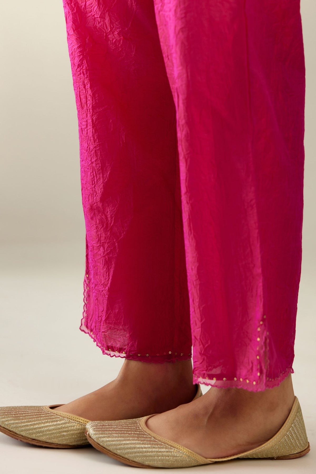 Jazzberry jam hand crushed silk straight pants with scalloped and embroidered organza at edges and detailed with a single line of sequins at hem