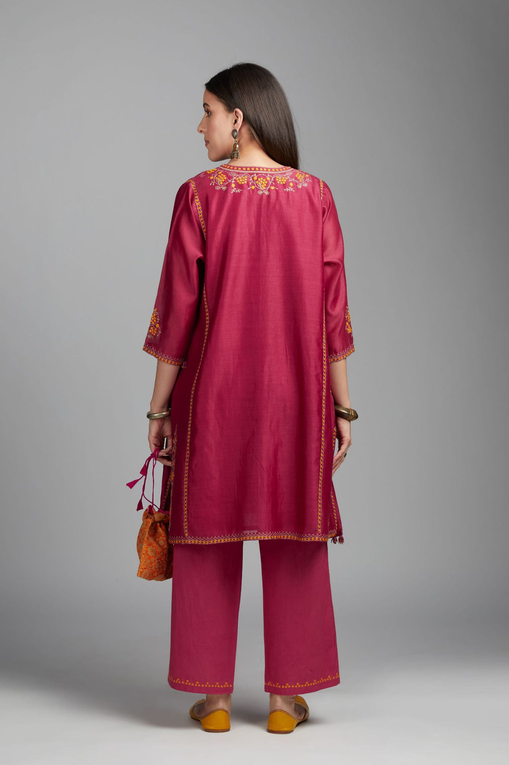 Deep wine short kalidar kurta set, highlighted with delicate contrast coloured embroidery