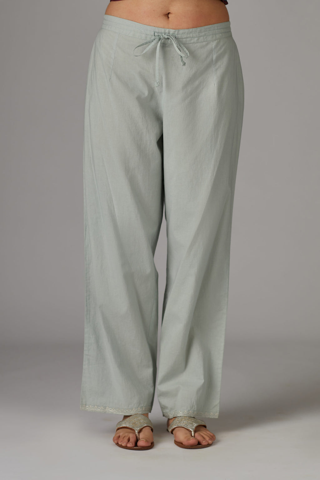 Grey cotton straight pants with aari embroidery at hem