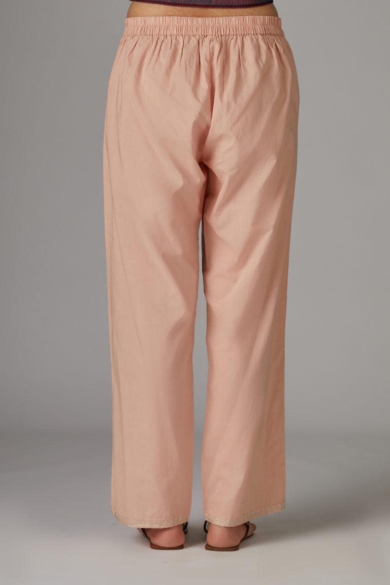 Pink cotton straight pants with aari embroidery at hem