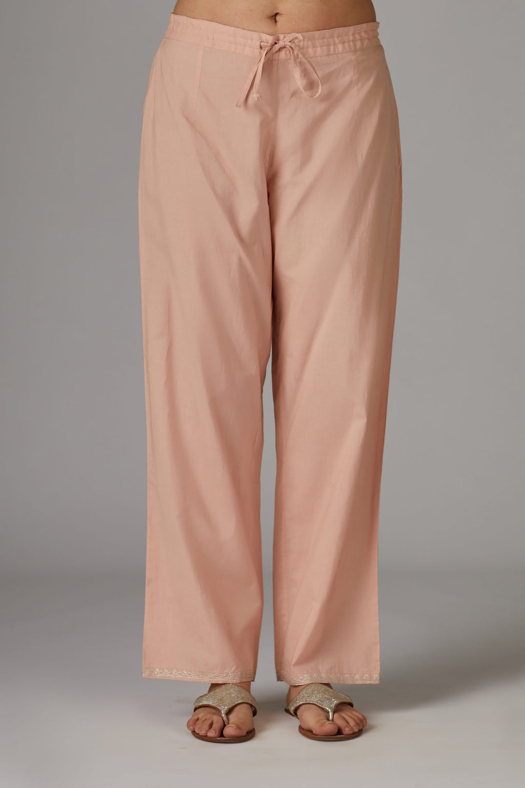 Pink cotton straight pants with aari embroidery at hem
