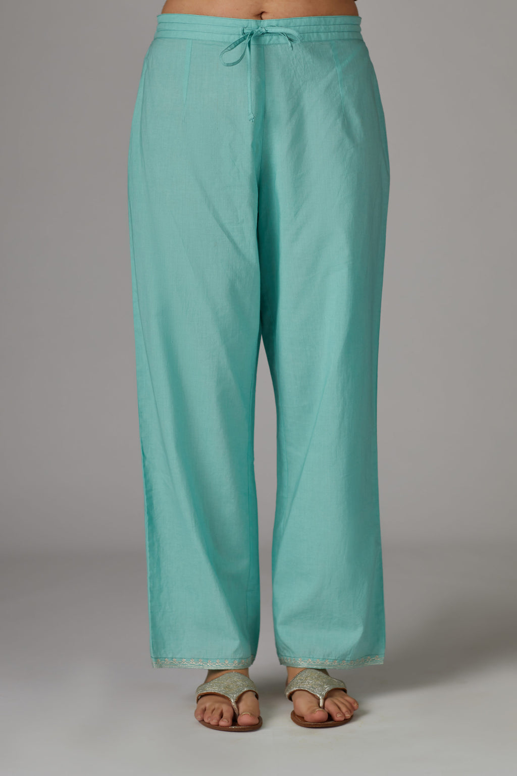 Teal cotton straight pants with aari embroidery at hem