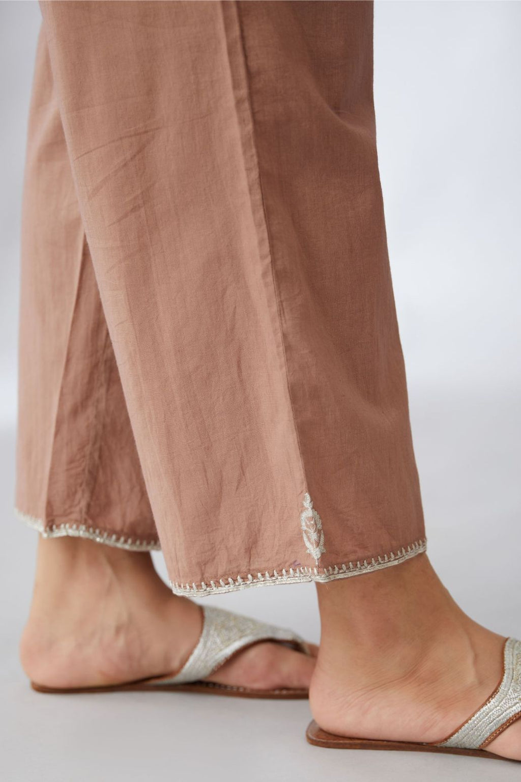 Pecan brown cotton straight pants with silver embroidery detailing at bottom hem (Pants)