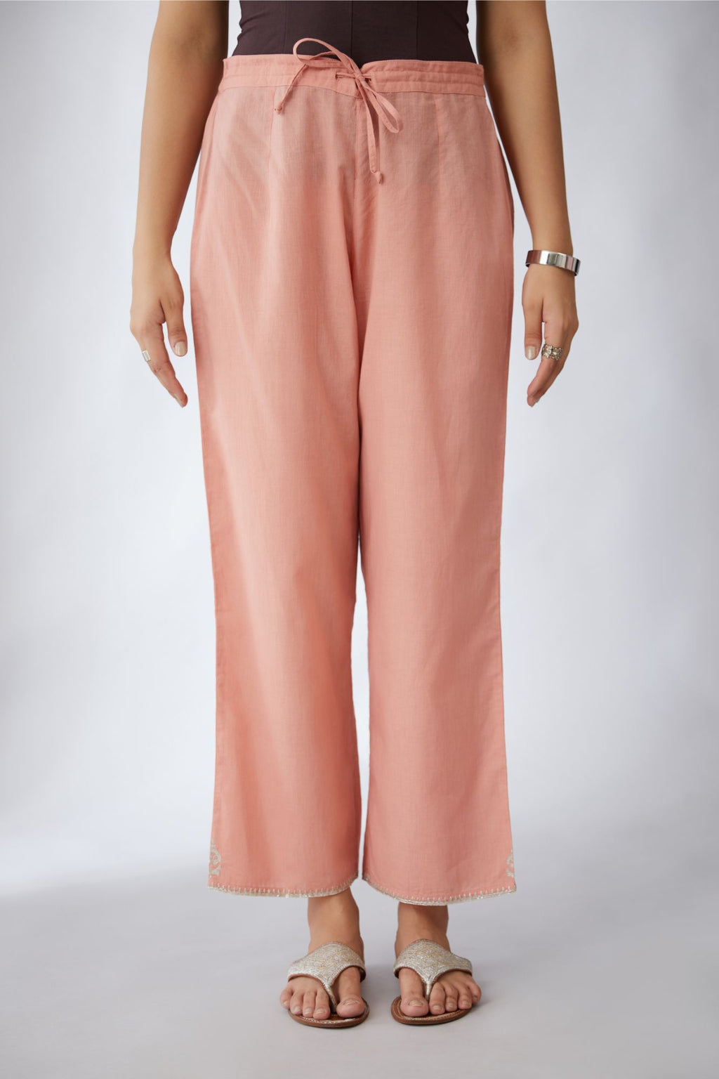 Salmon cotton straight pants with silver embroidery detailing at bottom hem (Pants)