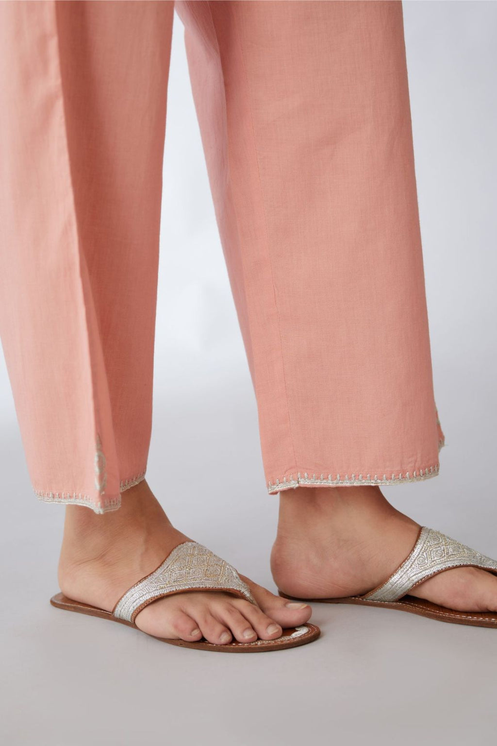Salmon cotton straight pants with silver embroidery detailing at bottom hem (Pants)