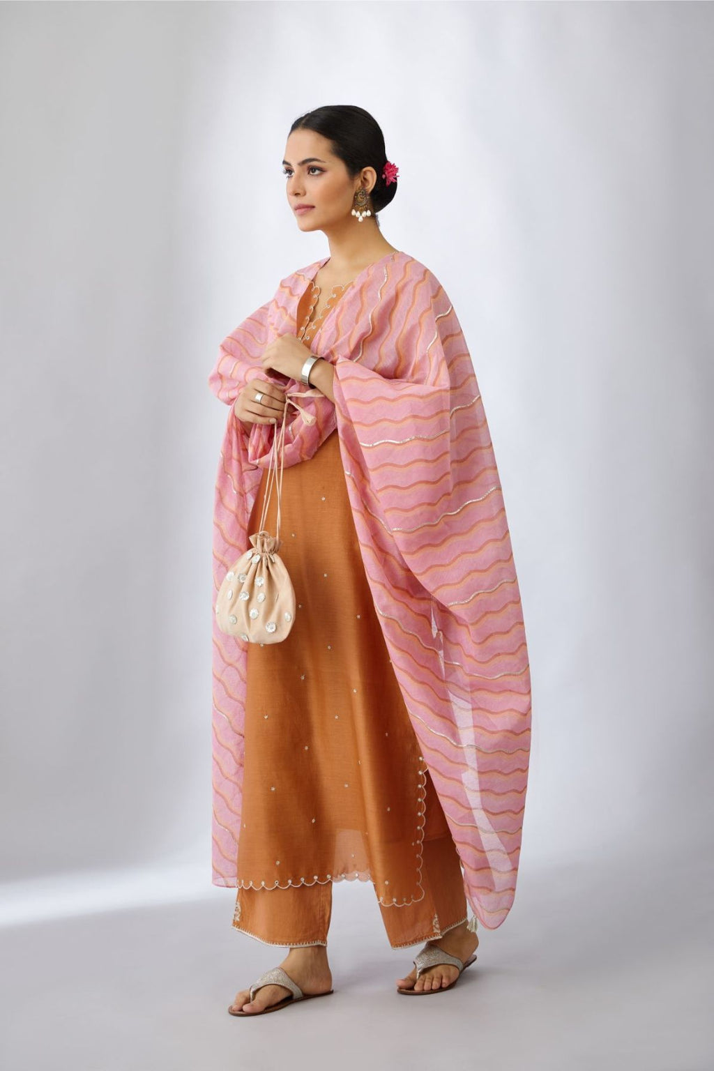 Copper silk chanderi straight kurta set with all-over delicate silver zari flowers and scalloped edges, highlighted with hand attached mirror .