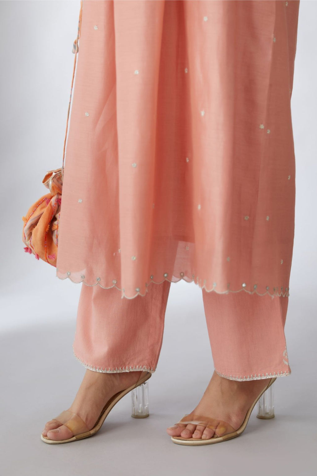 Silk chanderi Kurta dress set with all-over delicately embroidered silver zari flowers and scalloped edges, highlighted with hand attached mirrors.