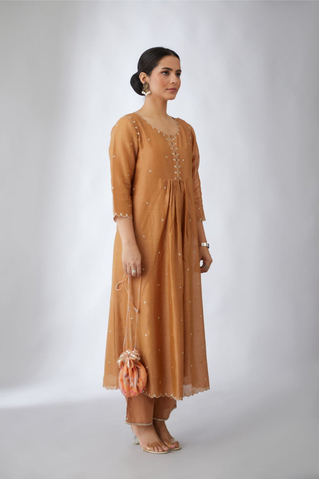Silk chanderi Kurta dress set with all-over delicately embroidered silver zari flowers and scalloped edges, highlighted with hand attached mirrors
