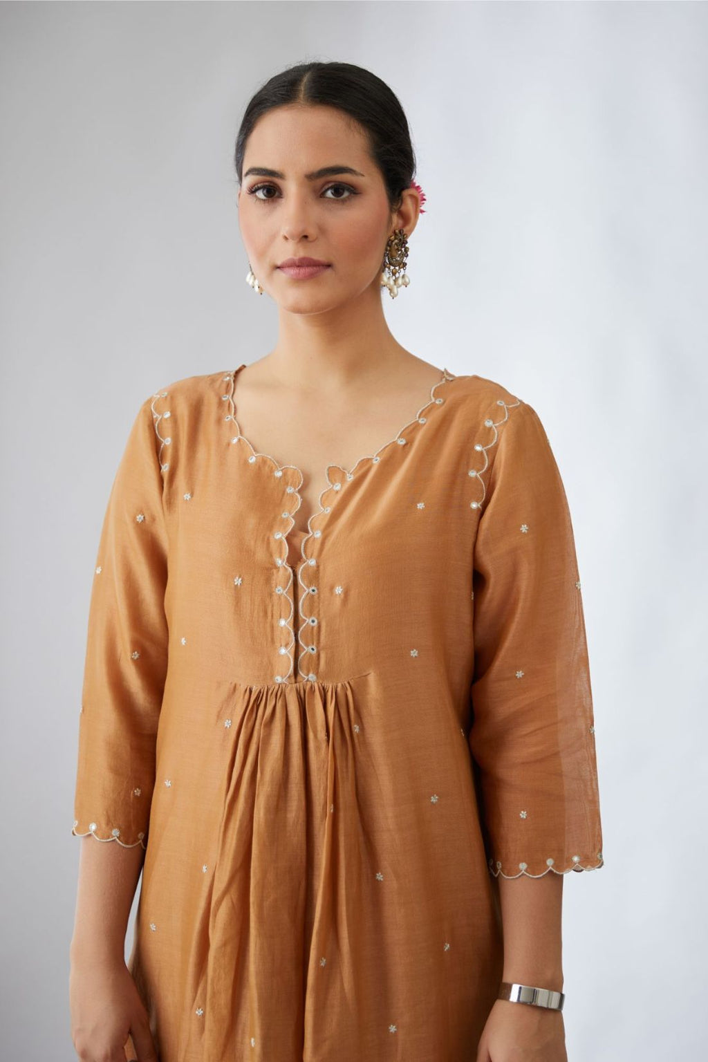 Silk chanderi Kurta dress set with all-over delicately embroidered silver zari flowers and scalloped edges, highlighted with hand attached mirrors