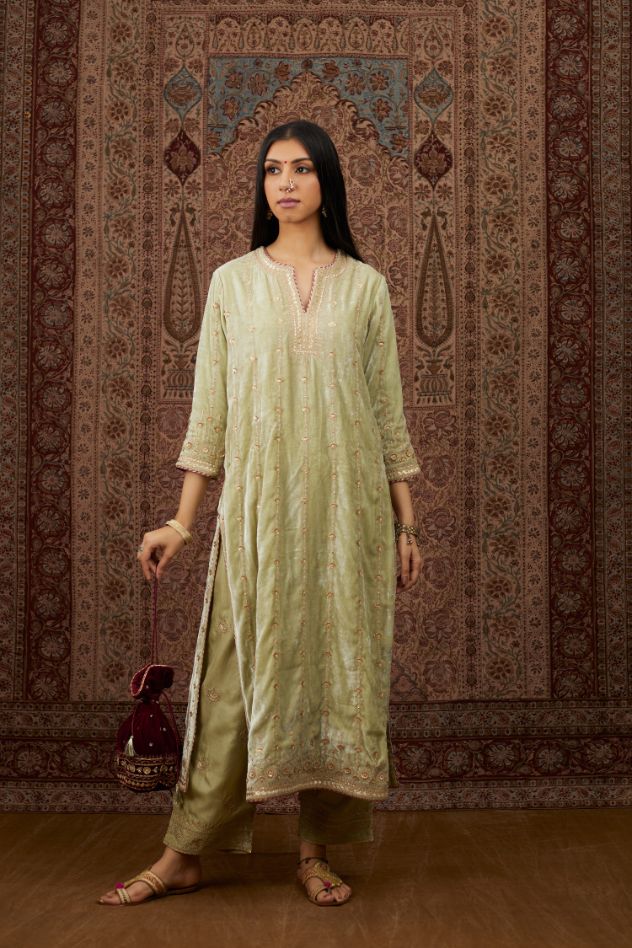 Soft green silk velvet straight kurta set with all over heavy gold gota and zari embroidery.