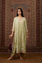 Soft green silk velvet straight kurta set with all over heavy gold gota and zari embroidery.