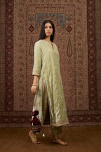 Soft green silk velvet straight kurta set with all over heavy gold gota and zari embroidery.