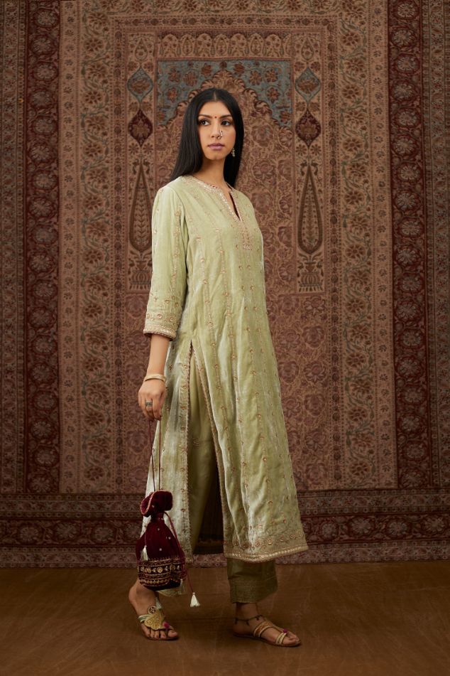Soft green silk velvet straight kurta set with all over heavy gold gota and zari embroidery.