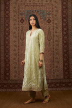 Soft green silk velvet straight kurta set with all over heavy gold gota and zari embroidery.