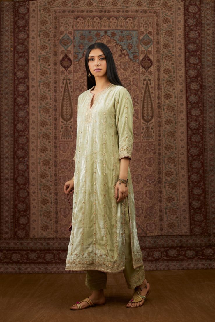 Soft green silk velvet straight kurta set with all over heavy gold gota and zari embroidery.