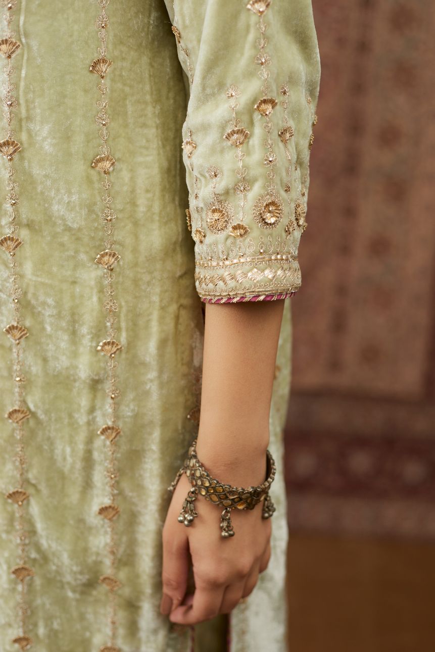 Soft green silk velvet straight kurta set with all over heavy gold gota and zari embroidery.