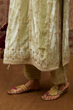 Soft green silk velvet straight kurta set with all over heavy gold gota and zari embroidery.