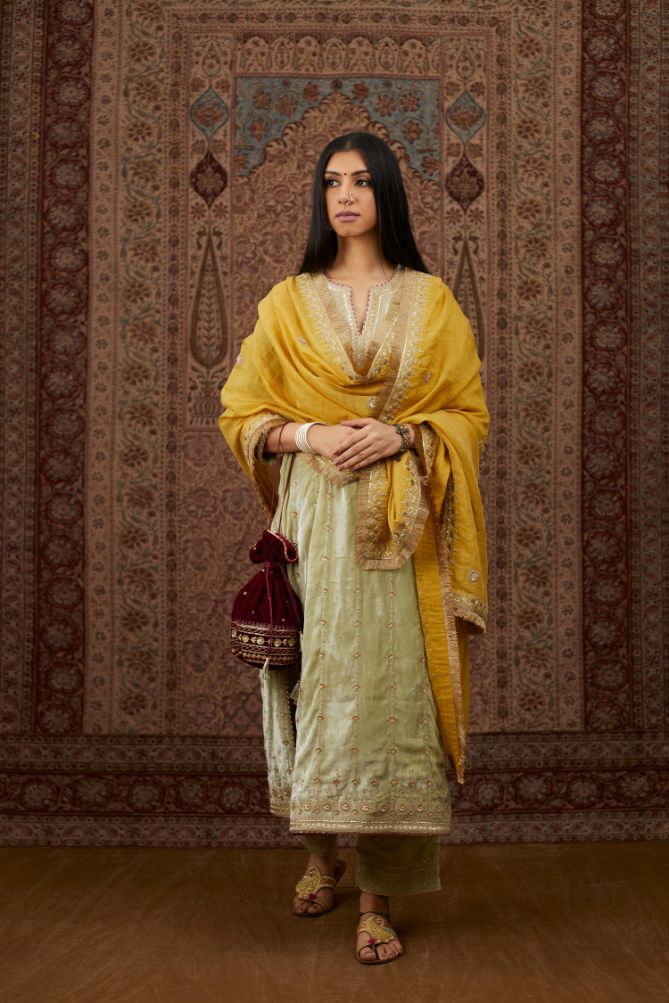 Soft green silk velvet straight kurta set with all over heavy gold gota and zari embroidery.