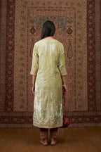 Soft green silk velvet kurta set with gold gota and zari embroidery butas and heavy borders at hem.