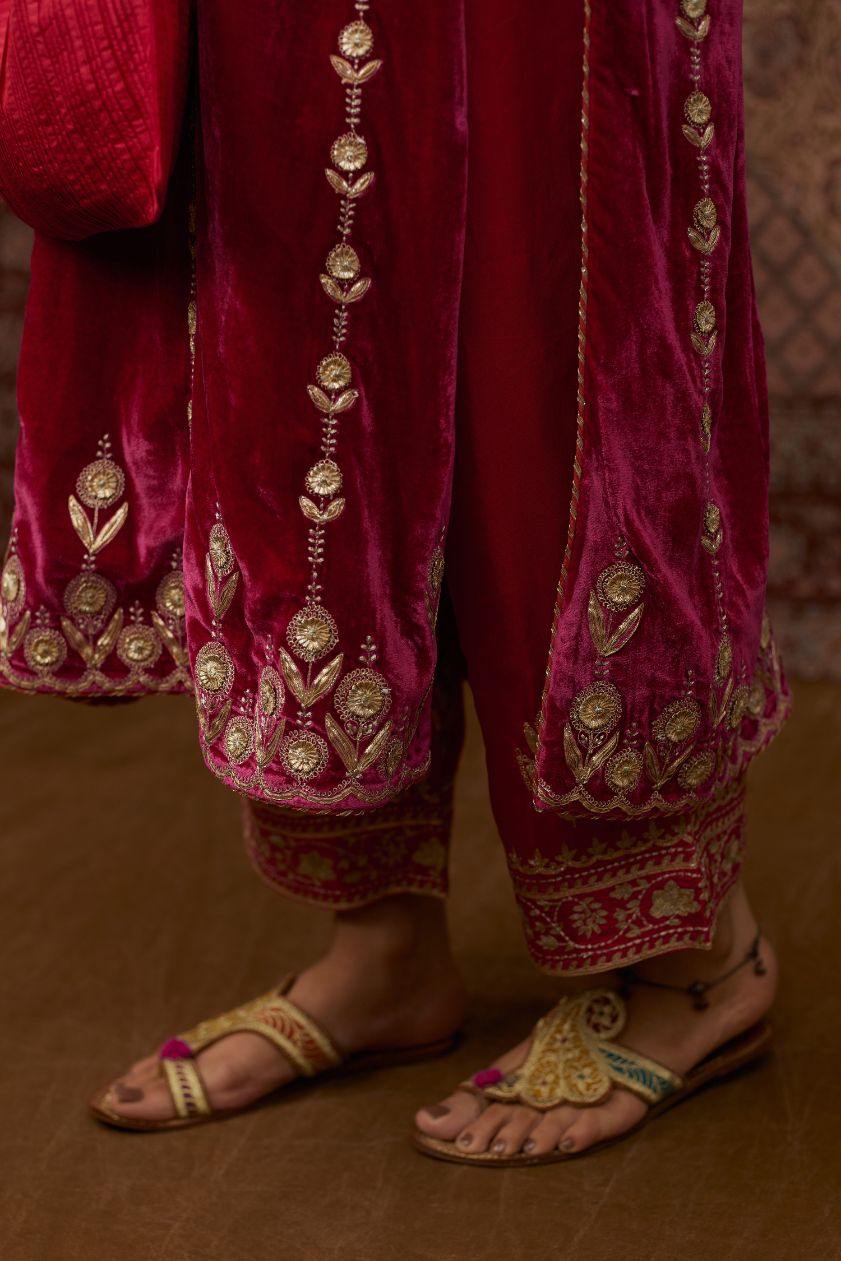 Fuchsia silk velvet straight kurta set with all over gold gota and zari embroidery.