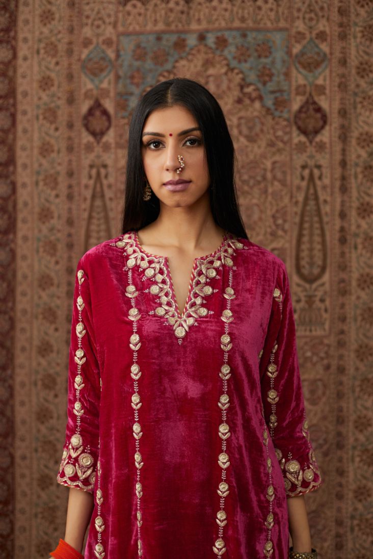 Fuchsia silk velvet straight kurta set with all over gold gota and zari embroidery.
