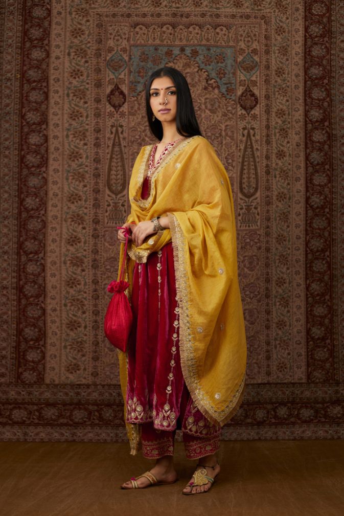 Fuchsia silk velvet straight kurta set with all over gold gota and zari embroidery.
