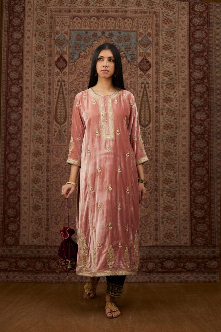 Dusty pink silk velvet kurta set with side panels, highlighted with gold gota and zari embroidery.
