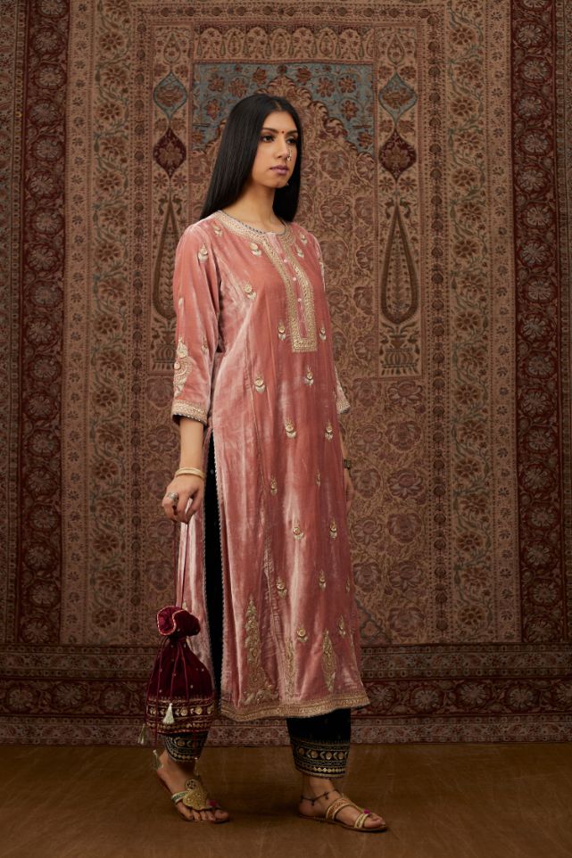 Dusty pink silk velvet kurta set with side panels, highlighted with gold gota and zari embroidery.