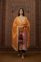 Dusty pink silk velvet kurta set with side panels, highlighted with gold gota and zari embroidery.