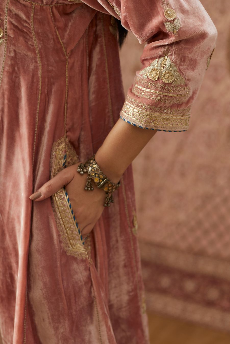Short kalidar silk velvet kurta set with button placket and all over gold gota and zari embroidery.