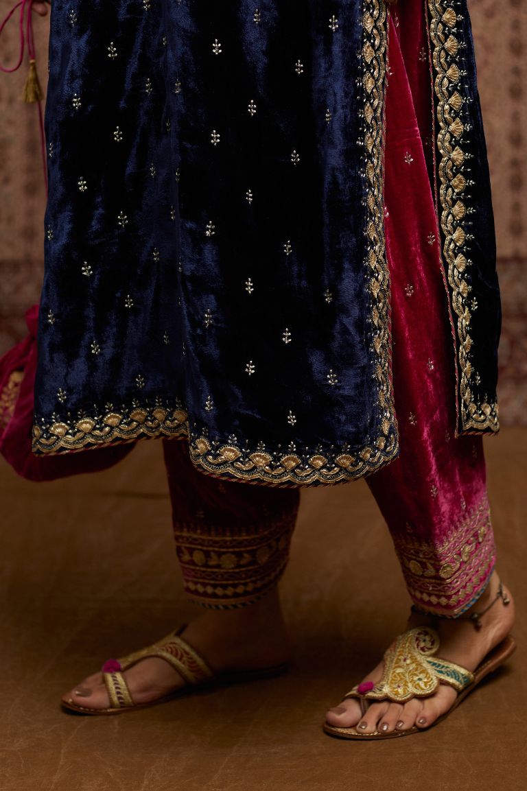 Navy blue silk velvet straight kurta set with gold gota and zari embroidery.
