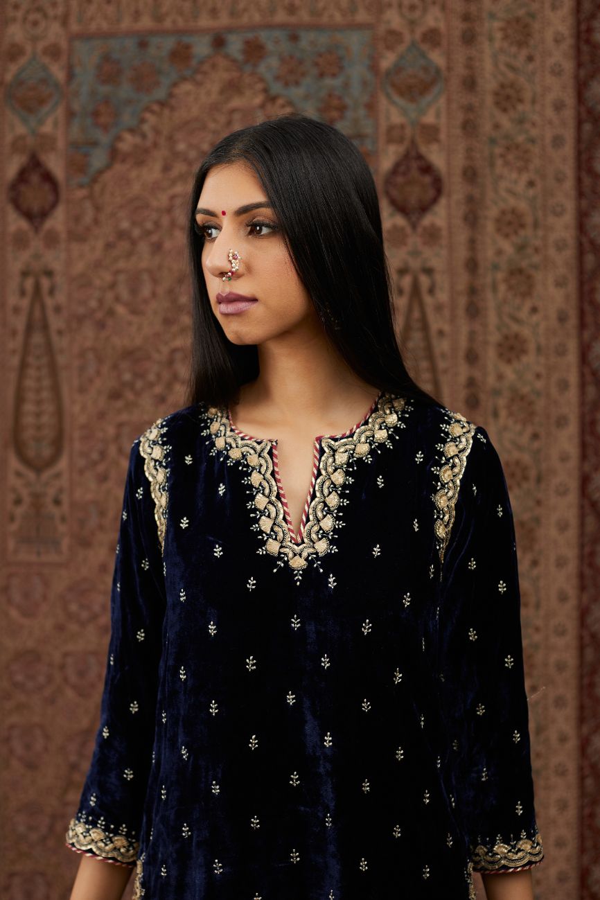 Navy blue silk velvet straight kurta set with gold gota and zari embroidery.