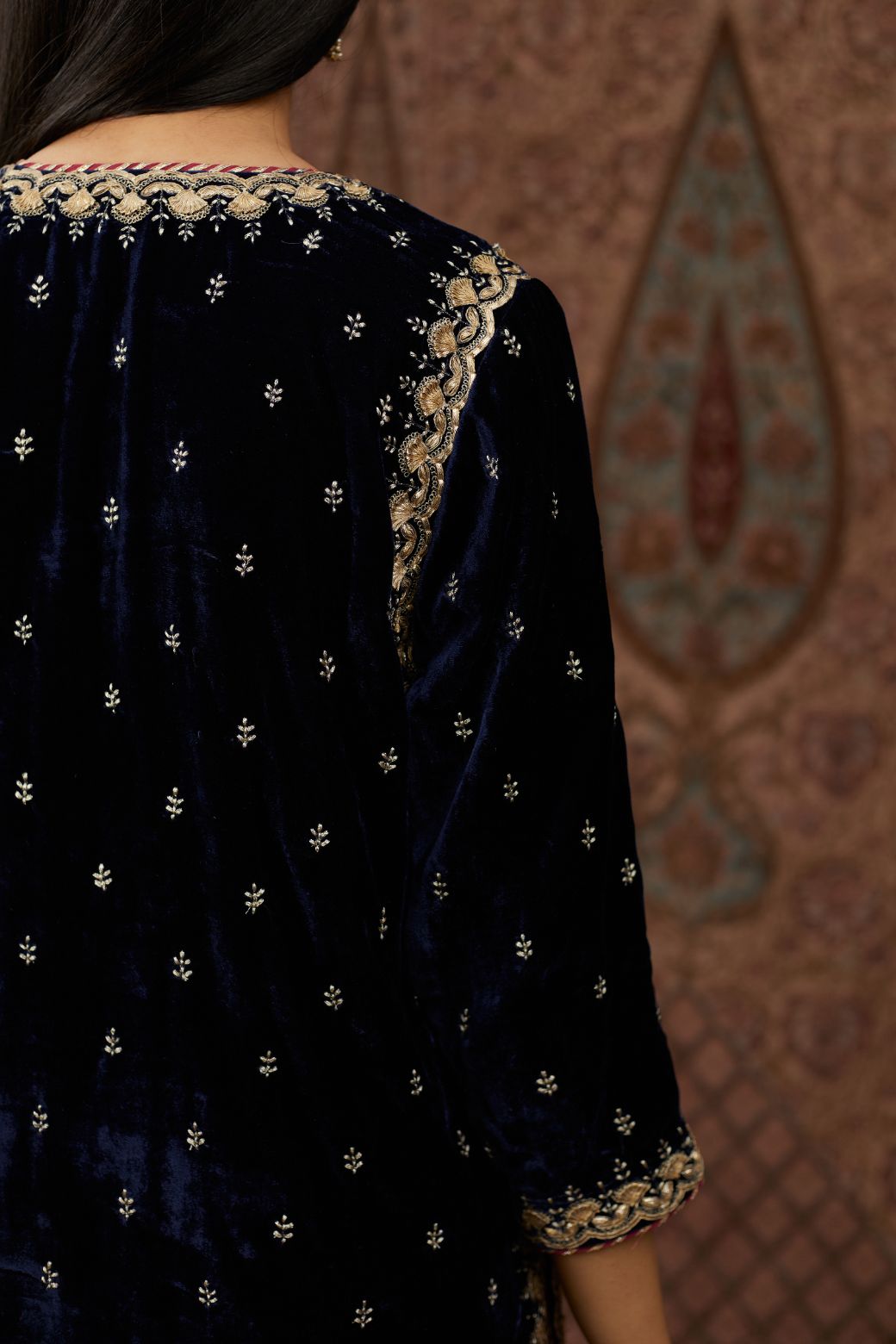 Navy blue silk velvet straight kurta set with gold gota and zari embroidery.