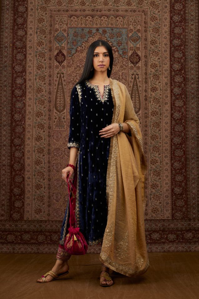 Navy blue silk velvet straight kurta set with gold gota and zari embroidery.