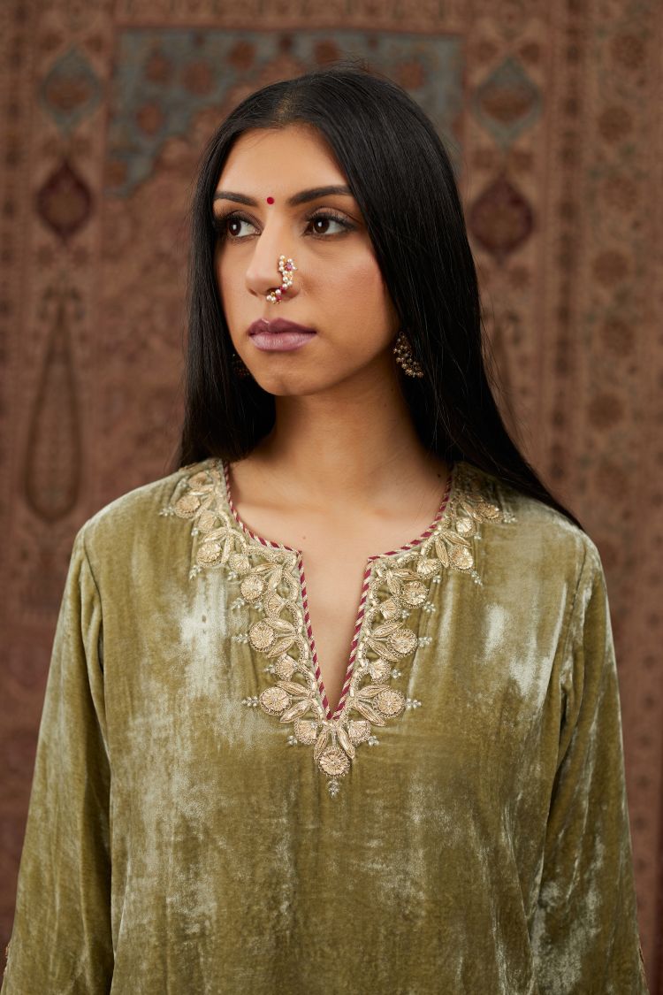 Dusty green silk velvet short kurta set with gold gota and zari embroidery.
